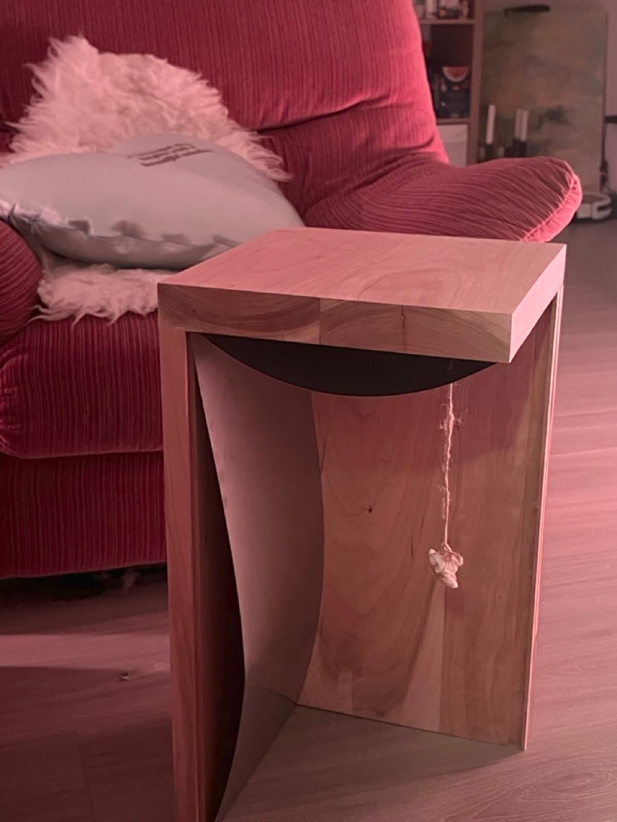 The finished side table in a living room next to an armchair
